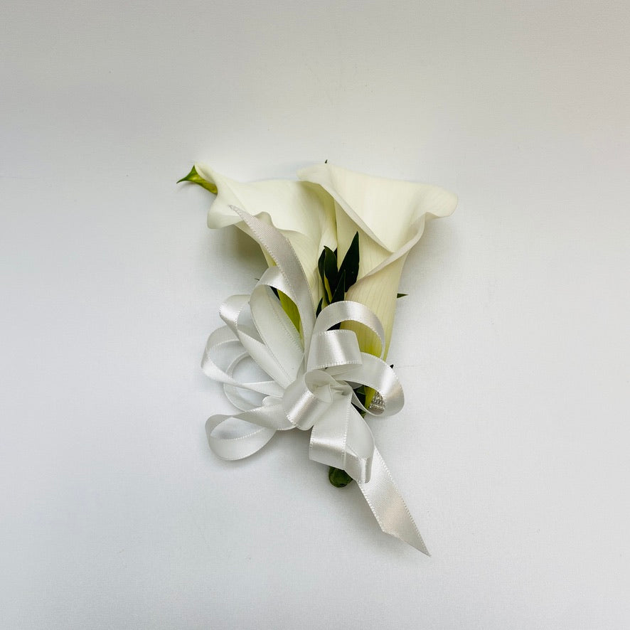 Prom boutonniere and wrist corsage with white mini calla lilies